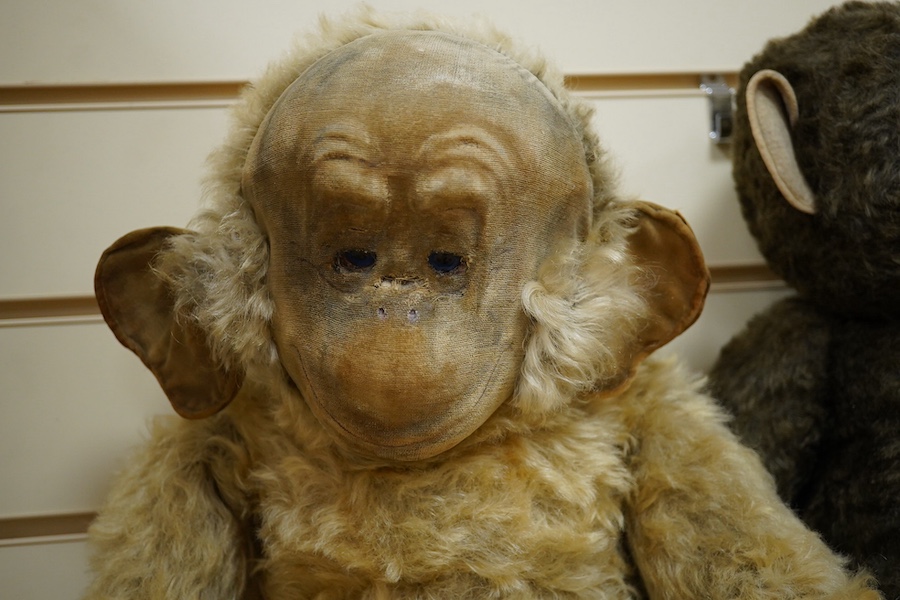 A Merrythought gold mohair monkey, with jointed limbs, and one other jointed monkey, Merrythought 62cm. Condition - poor to fair